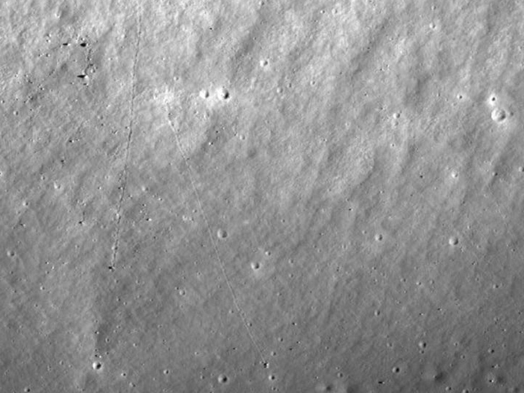 The tracks of two boulders that rolled downhill towards the Apollo 17 landing site. Each boulder is at the southern end of its track, where it casts a shadow to its left. Picture: NASA/GSFC/Arizona State University