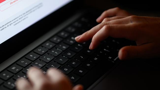 LONDON, ENGLAND - JANUARY 17: In this photo illustration, a teenage child looks at a screen of age-restricted content on a laptop screen on January 17, 2023 in London, England. The Bill aims to protect young and vulnerable viewers by introducing new rules for social media companies which host user-generated content, and for search engines, which will have tailored duties focussed on minimising the presentation of harmful search results. Content that platforms will need to remove includes child sexual abuse material, revenge pornography, selling illegal drugs or weapons, and terrorism. (Photo by Leon Neal/Getty Images)