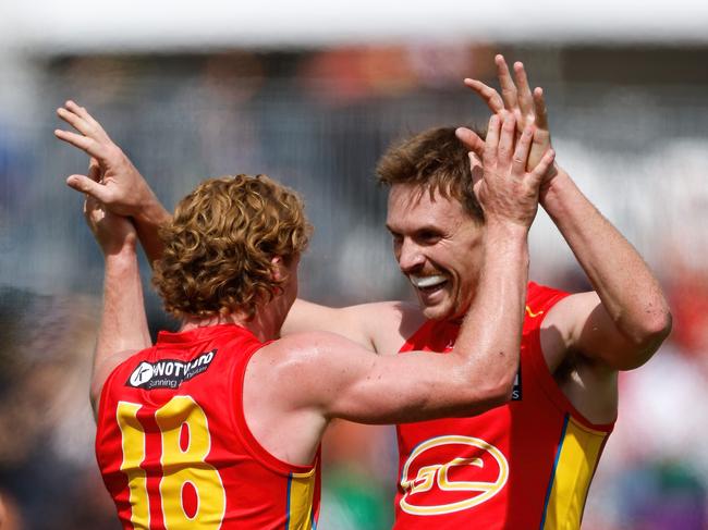 ADELAIDE, AUSTRALIA - APRIL 07: Matt Rowell of the Suns celebrates a goal with teammate Noah Anderson during the 2024 AFL Round 04 match between the Gold Coast SUNS and GWS GIANTS at Adelaide Hills - Mt Barker on April 07, 2024 in Adelaide, Australia. (Photo by Dylan Burns/AFL Photos via Getty Images)