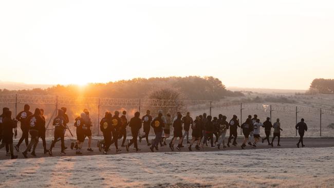 Australian Army soldiers from the 5th Battalion conduct morning physical training in the UK with Ukrainian recruits.