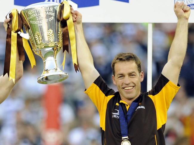 NOT FOR INTERNET... 27/09/2008 SPORT: 2008 Grand Final. Hawthorn v Geelong. MCG. Hawk captain Sam Mitchell with coach Alastair Clarkson hold up the premiership cup.