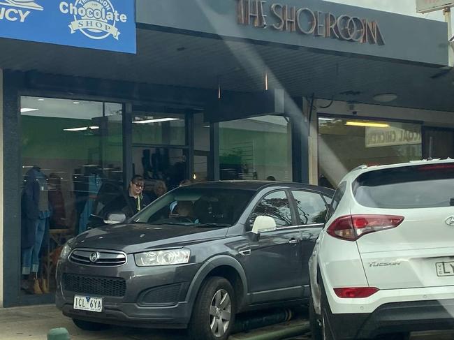 The car entered the footpath, hitting a pole that caused damage to the Shoe Room's roof sign on Seymour St in December, 2023. Picture: Supplied