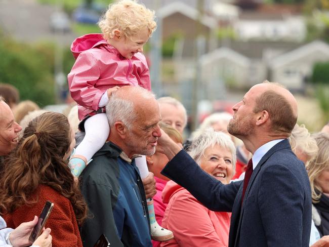 The royal greets a young fan in Llanelli, Wales. Picture: AFP