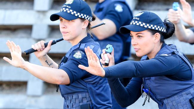 Inside the police academy: Recruits train using pepper spray and batons. Picture: Tim Carrafa