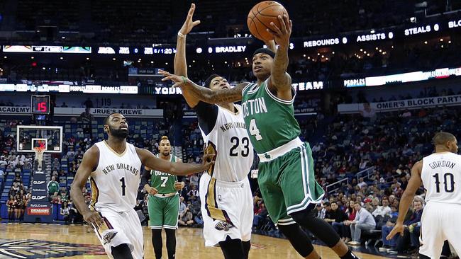 Boston Celtics guard Isaiah Thomas goes to the basket against New Orleans Pelicans forward Anthony Davis in the first half.