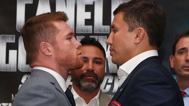 Canelo Alvarez and Gennady Golovkin, split by promoter Oscar De La Hoya.