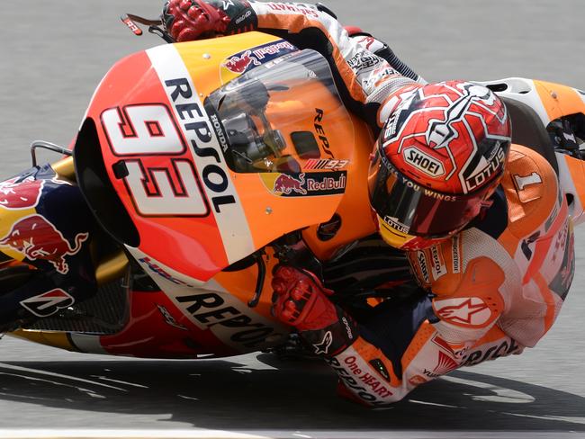 Repsol Honda Team's Spanish rider Marc Marquez steers his bike during the second training session of the MotoGP Grand Prix of Germany at the Sachsenring Circuit on July 10, 2015 in Hohenstein-Ernstthal, eastern Germany. AFP PHOTO / ROBERT MICHAEL