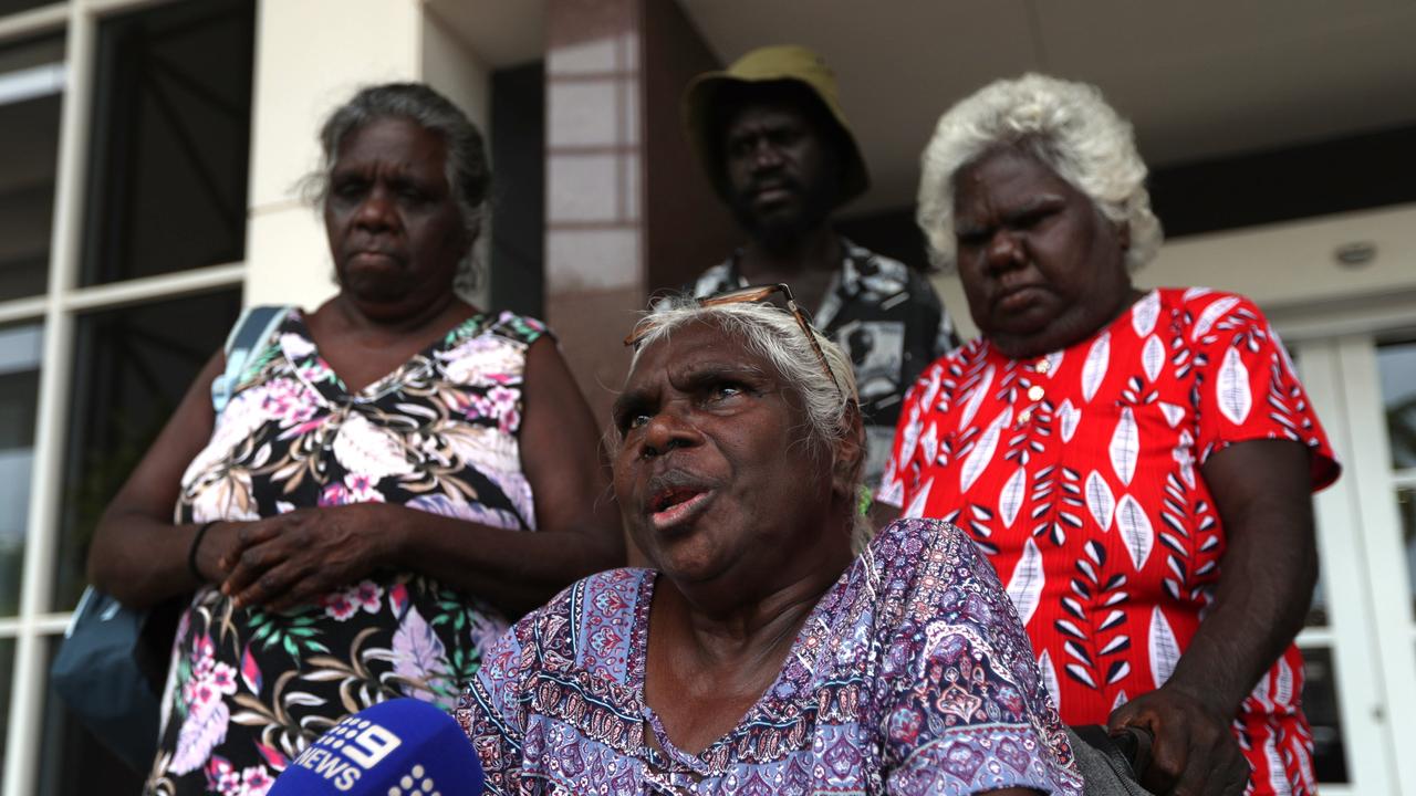 Judy Gungunbuy (seated), the mother of a 39-year-old Milingimbi man killed in a Rapid Creek car park brawl, with his aunt Joanne Garrawurra (left) and other family members outside the Supreme Court in Darwin. Picture: Zizi Averill