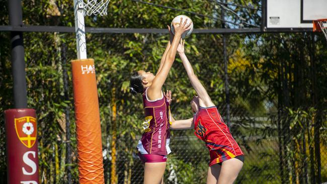 Open netball action from St Peters v St Hilda's.