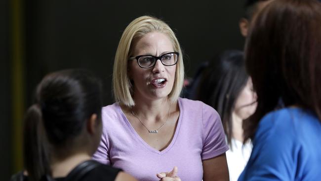 US Senatorial candidate Kyrsten Sinema speaks with volunteers in Phoenix. Picture: AP