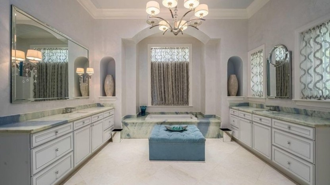 The massive master suite comes with French doors that lead outside, as well as dual closets, a luxurious bathroom, and a safe room. Picture: Supplied