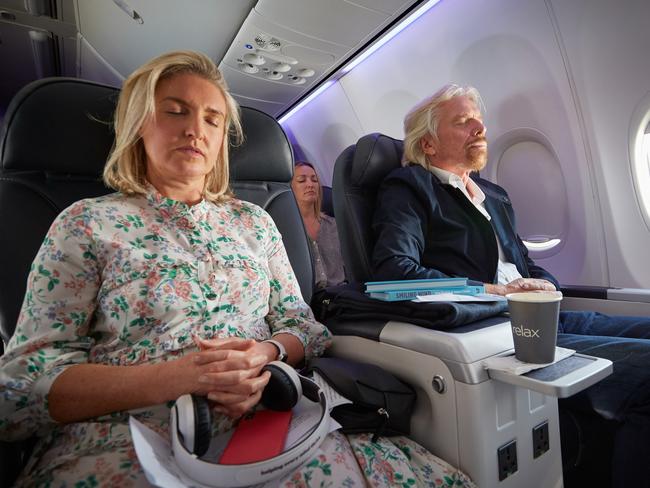 A supplied image obtained on Thursday, October 11, 2018, shows Virgin founder Sir Richard Branson hosting the world's first meditation flight, which departed Sydney on Thursday October 11, 2018. All Virgin Australia passengers will now be able to access Smiling Mind meditation apps on all domestic and international services to help calm their mind in-flight. (AAP Image/Virgin Australia, Nick Cubbin) NO ARCHIVING, EDITORIAL USE ONLY