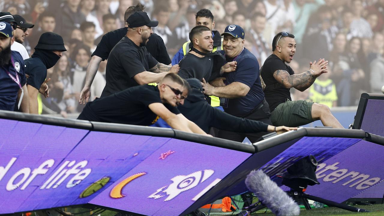 *APAC Sports Pictures of the Week - 2022, December 19* - MELBOURNE, AUSTRALIA - DECEMBER 17: Fans storm the pitch in protest during the round eight A-League Men's match between Melbourne City and Melbourne Victory at AAMI Park, on December 17, 2022, in Melbourne, Australia. (Photo by Darrian Traynor/Getty Images)