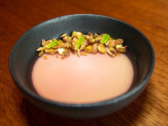 Malik’s Mahalabia dessert is an elegant panna cotta topped with a pink-tinged rosewater jelly which hides a bed of red-hued rhubarb. Picture: Linda Higginson