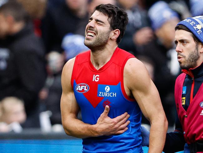 MELBOURNE, AUSTRALIA - JUNE 10: Christian Petracca of the Demons leaves the field injured during the 2024 AFL Round 13 match between the Collingwood Magpies and the Melbourne Demons at The Melbourne Cricket Ground on June 10, 2024 in Melbourne, Australia. (Photo by Dylan Burns/AFL Photos via Getty Images)