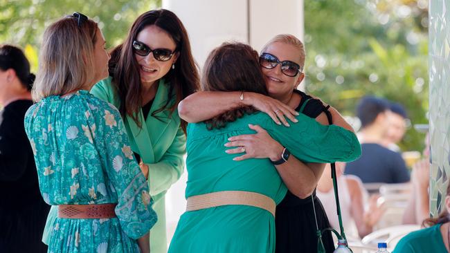 Ms Barter’s daughter Sally Leydon (black dress) was surrounded by supporters who wore green in honour of her mother. Picture: NCA NewsWire / Nikki Short