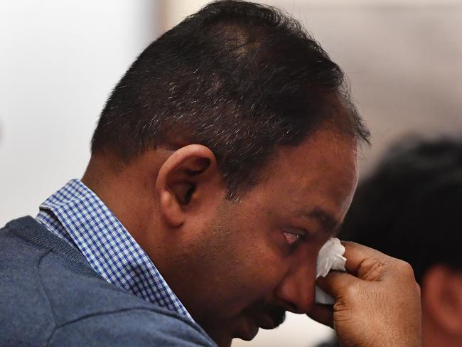 An emotional Vijay Vital, apartment owners in Mascot Towers, wipes away tears after delivering his opening statement to the Legislative Council Public Accountability Committee, Inquiry into Regulation of Building Standards, Building Quality and Building Disputes at New South Wales Parliament in Sydney, Monday, August 12, 2019. (AAP Image/Dean Lewins) NO ARCHIVING