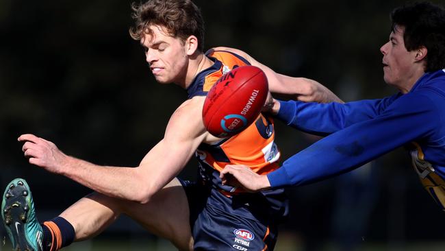 Mitch Podhajski snaps around the body during Calder Cannons’ win over Western Jets.