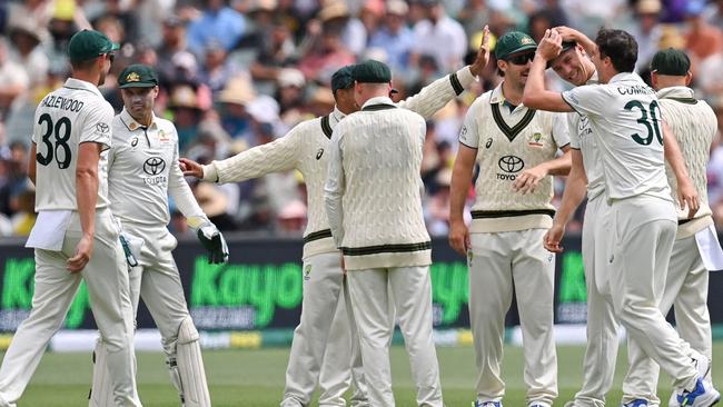 Pat Cummins celebrates with Cam Green early on the first day. Picture: Izhar KHAN / AFP