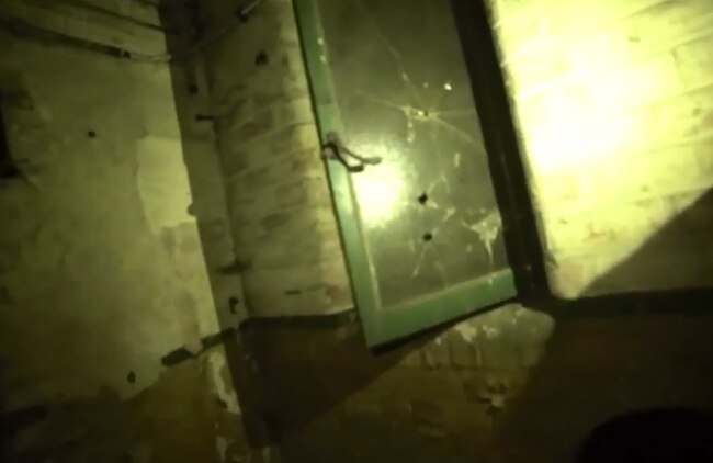 They find a window apparently riddled with bullets.