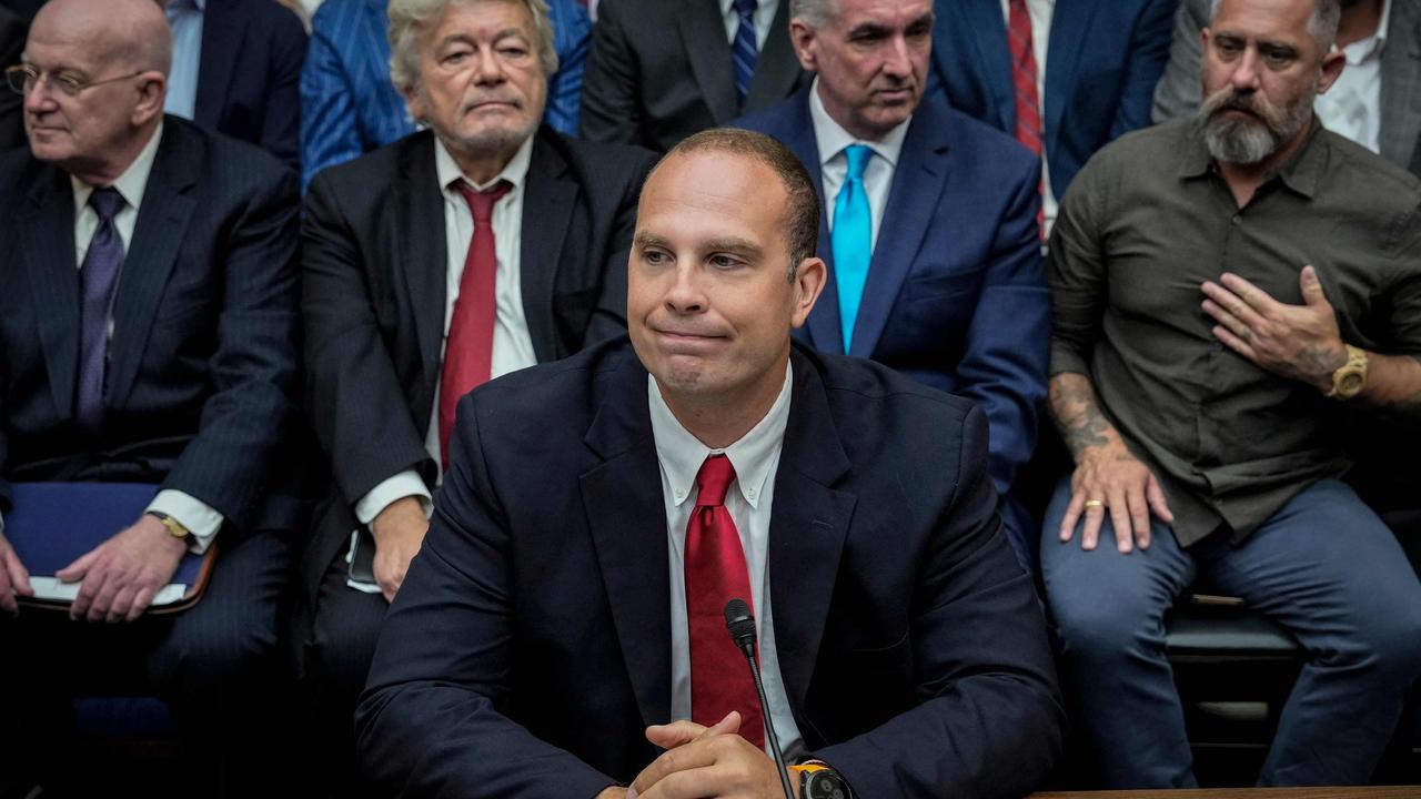 David Grusch, a former US intelligence agent, takes his seat at the UFO hearing. Picture: Getty Images via AFP