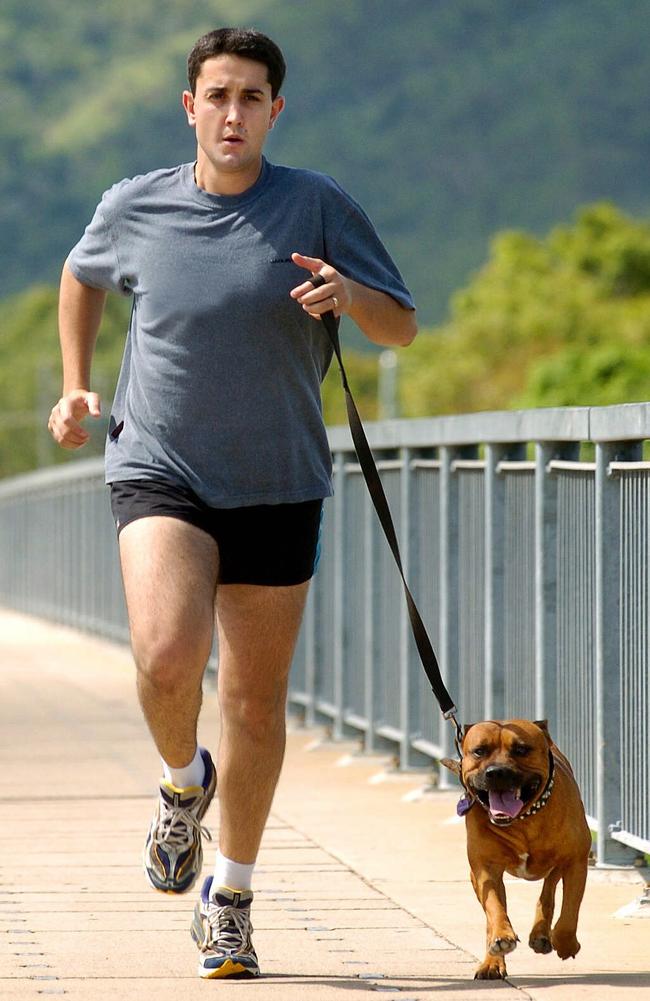 Townsville City Council division 10 candidate David Crisafulli running with his dog before the 2004 local government election.