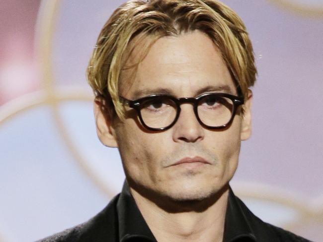 BEVERLY HILLS, CA - JANUARY 12: In this handout photo provided by NBCUniversal, Presenter Johnny Depp speaks onstage during the 71st Annual Golden Globe Award at The Beverly Hilton Hotel on January 12, 2014 in Beverly Hills, California. (Photo by Paul Drinkwater/NBCUniversal via Getty Images)