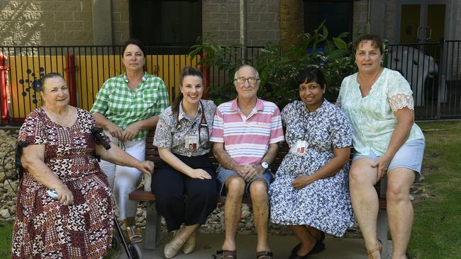 Peter Bakker sits with his family and health carers at Townsville University Hospital. Photo: Ian Hitchcock.