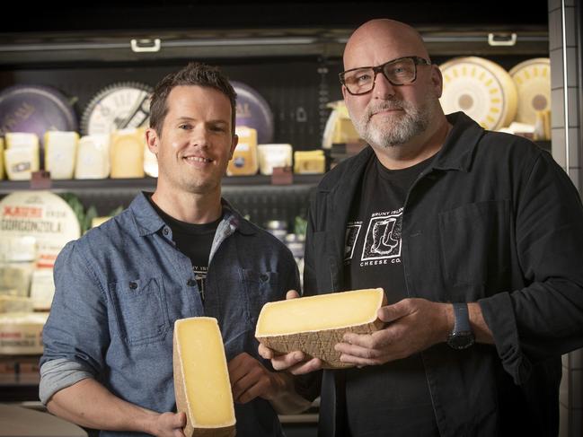 Bruny Island Cheese Company, head cheese maker Luke Jackson and founder Nick Haddow with their award winning Raw Milk C2 Cheese at Hill Street Grocer, Sandy Bay. Picture: Chris Kidd