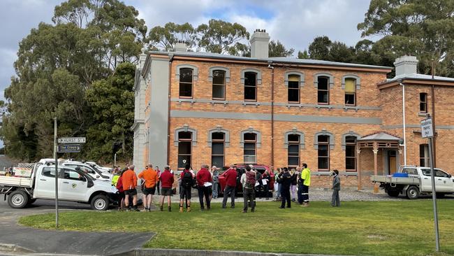 Police, DRE and army of volunteers working out a plan after 230 whales were stranded at Strahan. Photo: Sam Flanagan