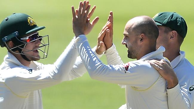 Australian spinner Nathan Lyon (right) celebrates claiming the wicket of South Africa’s Dean Elgar in the second Test.