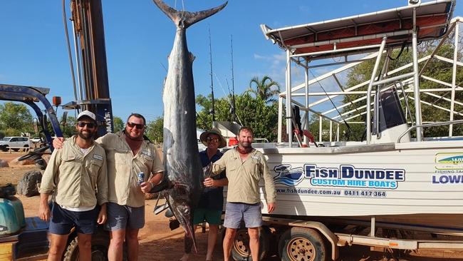 Vaughan Cullen and his mates with the 100kg black marlin they reeled in off Dundee Beach. Picture: Vaughan Cullen