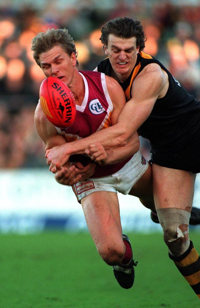 Brendon Gale tackles Brisbane player Dion Scott during a match in 1996. Picture: Graham Crouch