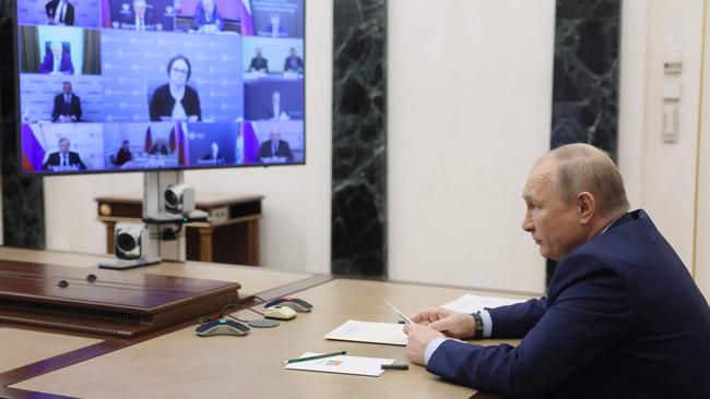 Vladimir Putin chairs a meeting on the development of the oil industry via a video link in Moscow on May 17.