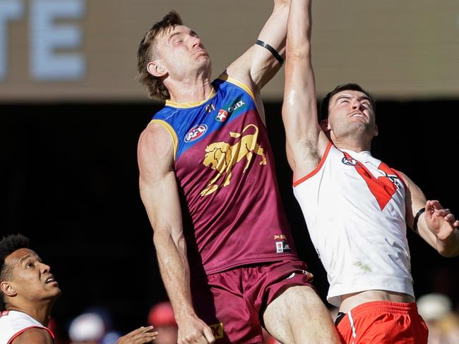 BRISBANE, AUSTRALIA - JULY 21: Harris Andrews of the Lions and Logan McDonald of the Swans compete for the ball during the 2024 AFL Round 19 match between the Brisbane Lions and the Sydney Swans at The Gabba on July 21, 2024 in Brisbane, Australia. (Photo by Russell Freeman/AFL Photos via Getty Images)