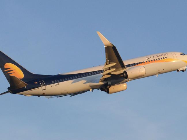 (FILES) This file photograph taken on March 18, 2015, shows an Indian Jet Airways flight taking off from Sardar Vallabhbhai Patel International Airport in Ahmedabad. Cricketer Harbhajan Singh on April 26, 2017 accused a Jet Airways pilot of hurling racial abuse at an Indian passenger and assaulting a woman on a domestic flight.  / AFP PHOTO / SAM PANTHAKY