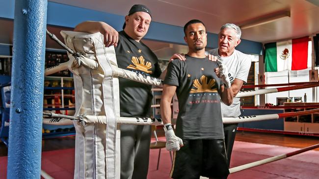 Mark Schleibs first met trainers Sam (left) and Ben Brizzi (right) when he was sparring at 12 years old. Picture: Tim Carrafa