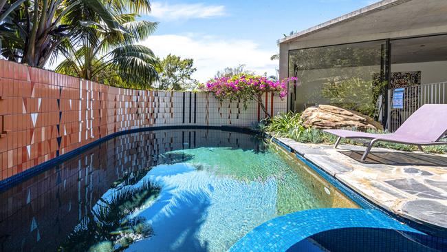 At the bottom of the cliff garden, a pool awaits.