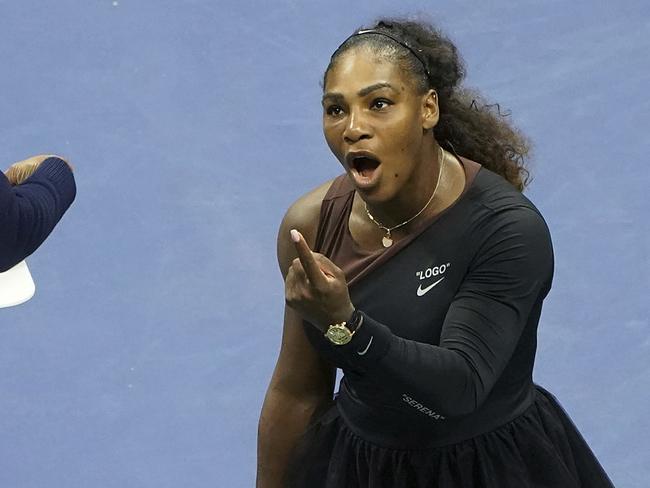 FILE - In this Saturday, Sept. 8, 2018, file photo, Serena Williams argues with the chair umpire during a match against Naomi Osaka, of Japan, during the women's finals of the U.S. Open tennis tournament at the USTA Billie Jean King National Tennis Center,  in New York. Some black women say Serena Williamsâ€™ experience at the U.S. Open final resonates with them. They say they are often forced to watch their tone and words in the workplace in ways that men and other women are not. Otherwise, they say, they risk being branded an "Angry Black Woman." (Photo by Greg Allen/Invision/AP, File)