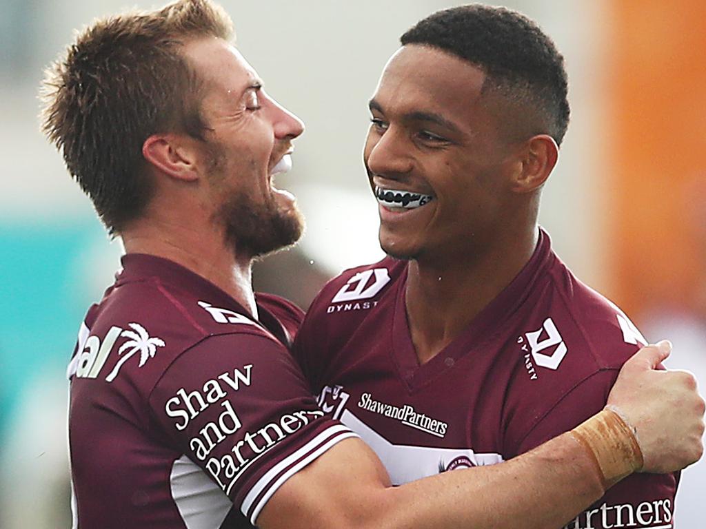 Foran celebrates with Manly teammate Jason Saab after he scored a try against the Gold Coast Titans in Mudgee. Picture: Mark Metcalfe/Getty Images