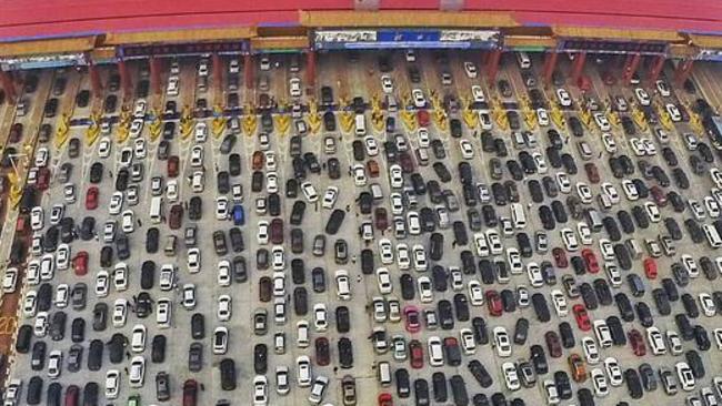 Heck of a commute: Daily traffic jams last three hours in rush hour in Beijing. Picture: Reuters