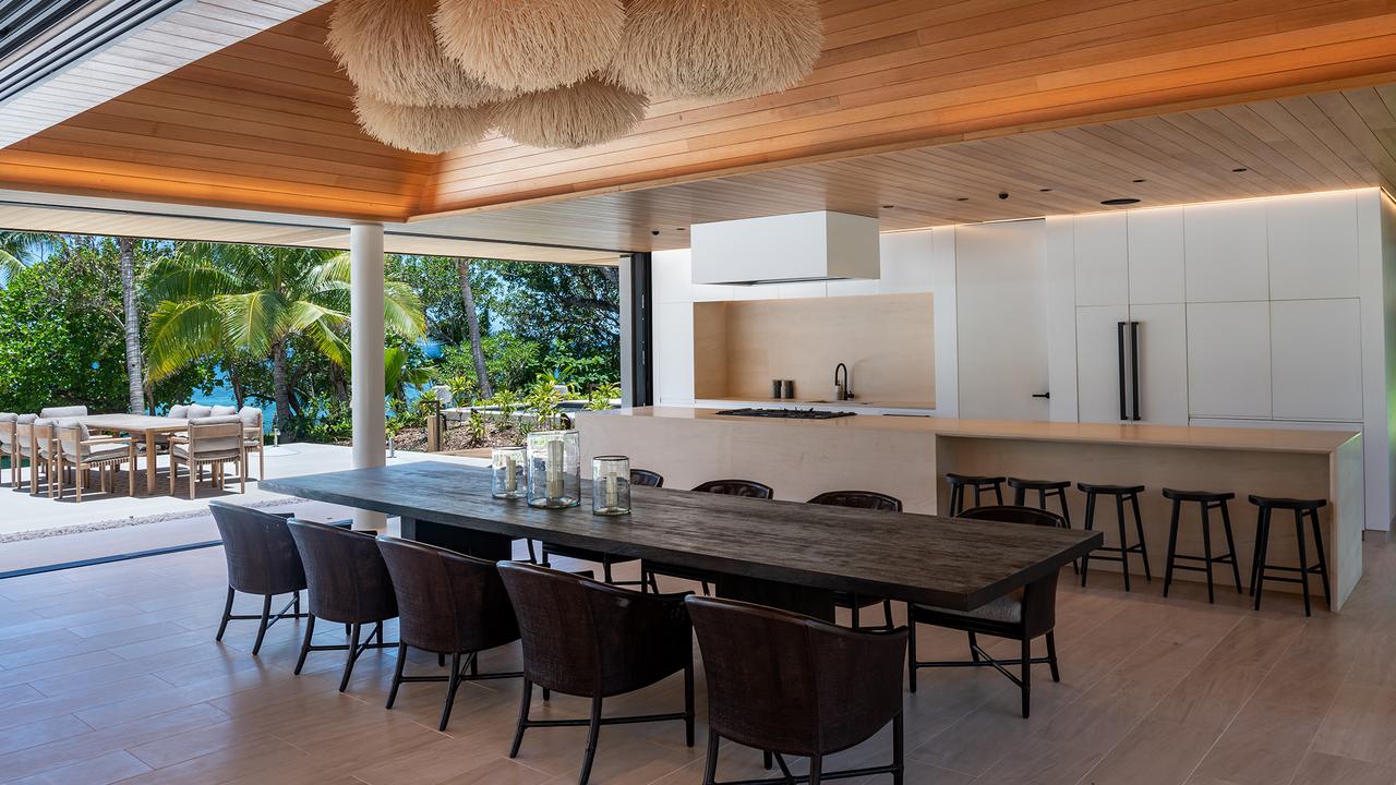 The house features an incredible dining table and kitchen. Picture: Fiji Tourism / Vomo Island Resort