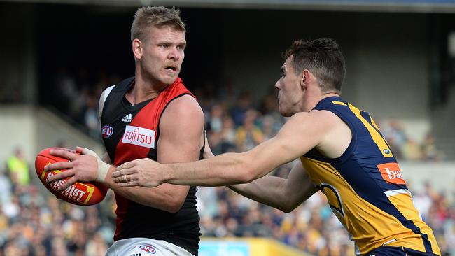 Michael Hurley is tackled by Luke Shuey. Picture: Daniel Wilkins