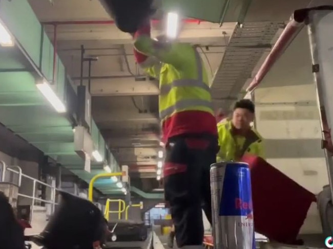 Footage of the baggage handlers appears to show them slamming bags. Picture: TikTok