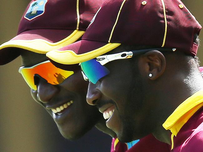 West Indies Darren Sammy and Andre Russell celebrates Russell's catch to dismiss Kyle Coetzer for 96 during West Indies v Scotland ICC Cricket World Cup warm up match at the SCG. pic. Phil Hillyard