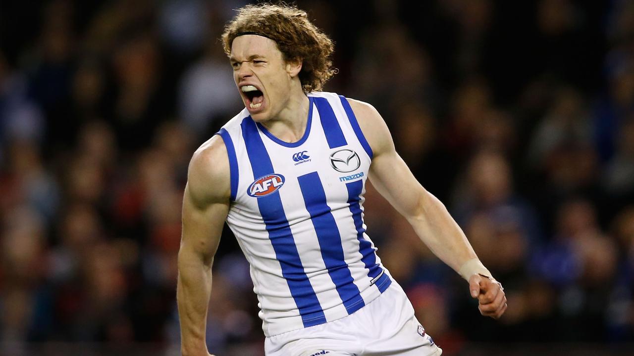 MELBOURNE, AUSTRALIA - JULY 17: Ben Brown of the Kangaroos celebrates a goal during the 2015 AFL round 16 match between the North Melbourne Kangaroos and the Essendon Bombers at Etihad Stadium, Melbourne, Australia on July 17, 2015. (Photo by Adam Trafford/AFL Media/Getty Images)