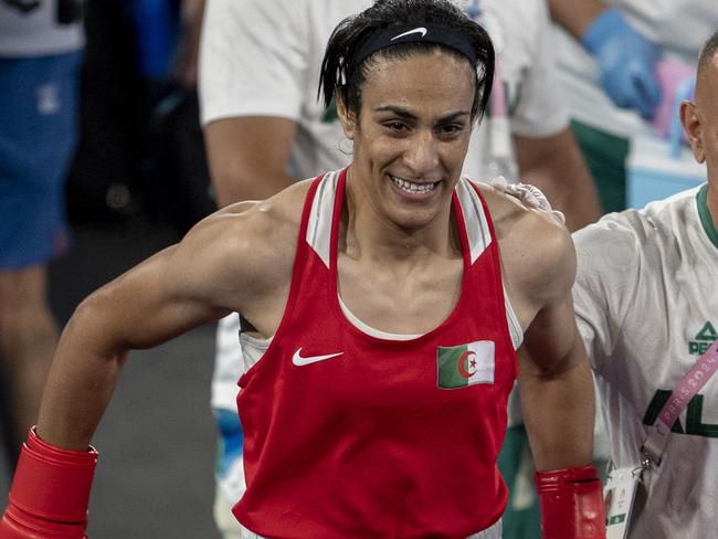 PARIS, FRANCE - AUGUST 09: Imane Khelif (red) of Team Algeria competes with Liu Yang (blue) of Chine in the Boxing Women's 66kg Final match on day fourteen of the Olympic Games Paris 2024 at Roland Garros on August 09, 2024 in Paris, France. (Photo by Aytac Unal/Anadolu via Getty Images)