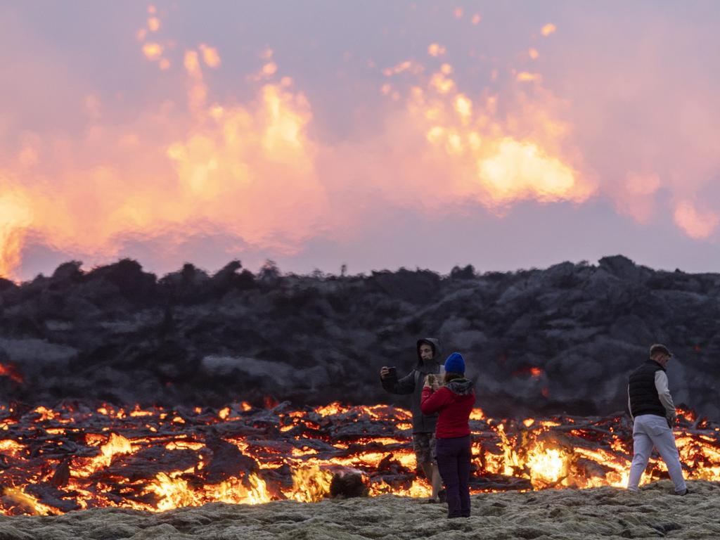 People are pictured standing within metres of lava. Picture: Emin Yogurtcuoglu/Anadolu Agency via Getty Images
