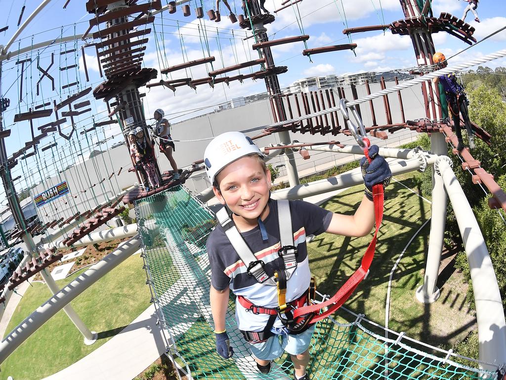 Will Teissl, 11, tests out the Next Level high ropes course on Cornmeal Creek at Sunshine Plaza. Picture: Patrick Woods