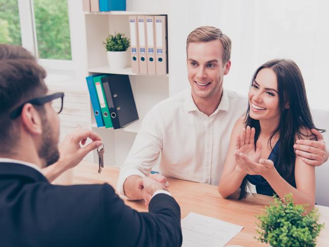 A couple discussing their home loan with a mortgage broker. Picture: iStock.